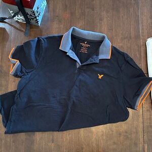 Men's black Polo Shirt with Orange Accents